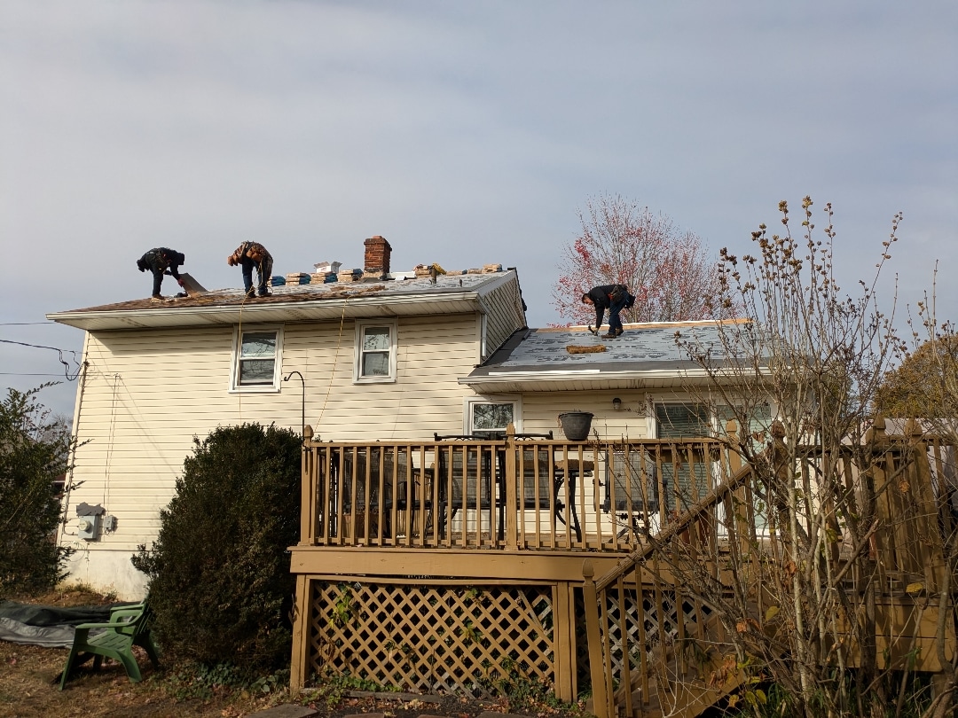 Contractors actively working on residential Roofing in Wilmington DE by Rain Drainz.